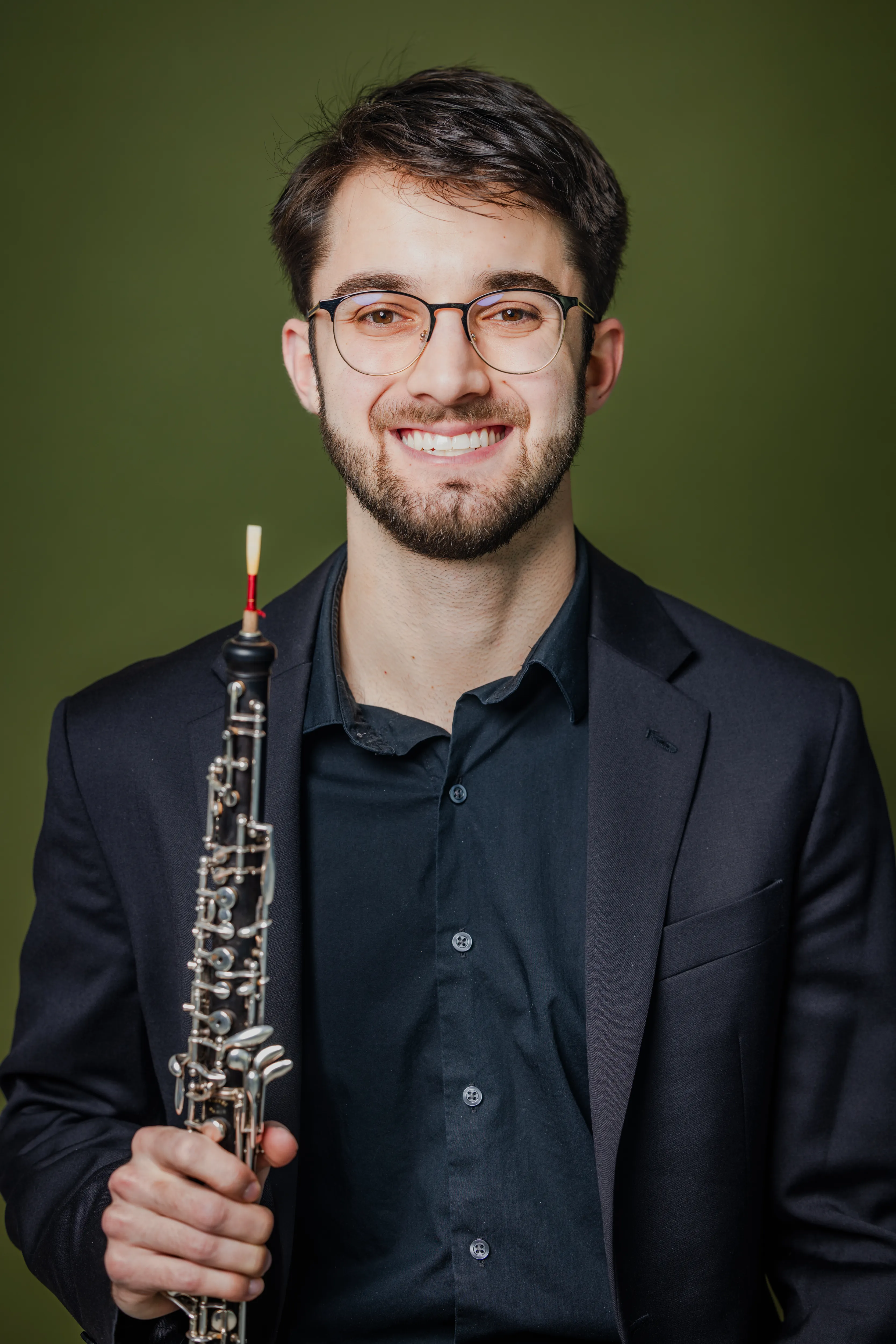 James Laase holding his oboe